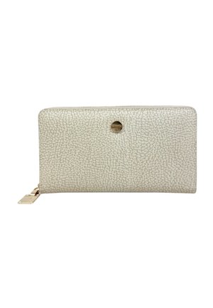 Portafoglio beige texturizzato con zip che gira attorno, cursore in metallo dorato e piccolo dettaglio logo metallico rotondo al centro frontale.