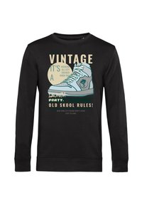 Felpa nera a maniche lunghe con una grande illustrazione di una sneaker blu e testo che fa riferimento allo stile vintage, alle regole old school e a un tema di festa di quartiere.