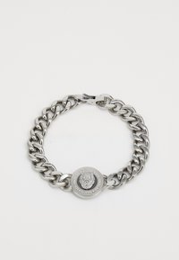 Bracelet en argent avec des maillons épais et un fermoir rond arborant un emblème de lion. Texture lisse avec une finition poli.