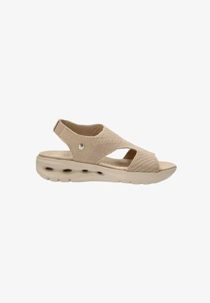 Sandalia beige con punta abierta y talón con tira trasera, parte superior de punto, suela acolchada con agujeros de ventilación y plantilla texturizada para mayor comodidad.