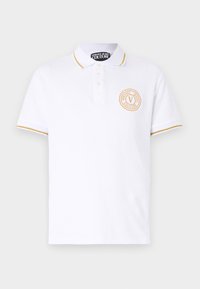 Biała koszulka polo z kołnierzykiem, złotym wykończeniem przy mankietach oraz okrągłym logo z napisem "Versace Jeans Couture" w złotym kolorze. Wykonana z bawełny.