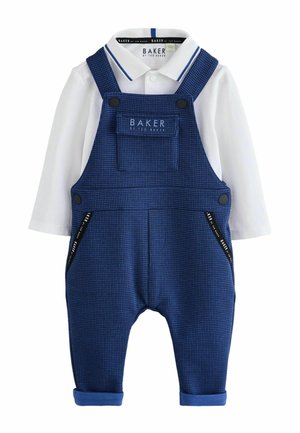White long-sleeve polo shirt under blue checkered overalls with front pocket and black button details for baby or toddler.