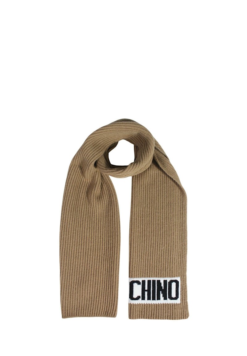 Sciarpa beige a coste realizzata in tessuto a maglia, caratterizzata da un'etichetta nera e bianca con la parola "CHINO" per un tocco di dettaglio.