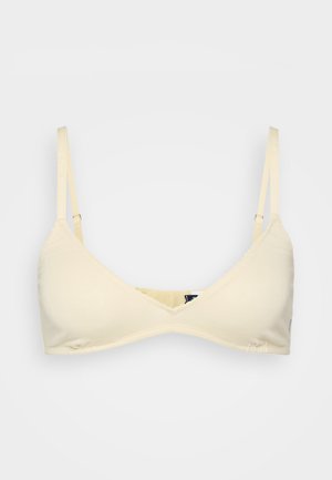 Bralette beige chiaro con design triangolare, spalline regolabili e orlo ondulato. Tessuto morbido senza imbottitura.