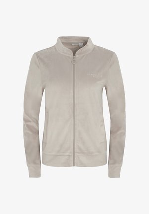 Világos bézs színű bársonyos cipzáros dzseki. Álló gallérral, két oldalzsebbel és finom logó részletekkel a mellkason. Sima tapintású felület.