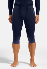 Marineblaue Kompressionsstrumpfhosen mit strukturiertem Finish, unterstützendem Taillenbund und gerippten Bündchen. Entwickelt für optimale Passform und Flexibilität.