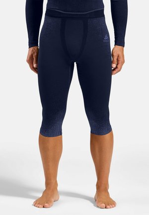 Marineblaue Kompressionsstrumpfhosen mit strukturiertem Finish, unterstützendem Taillenbund und gerippten Bündchen. Entwickelt für optimale Passform und Flexibilität.