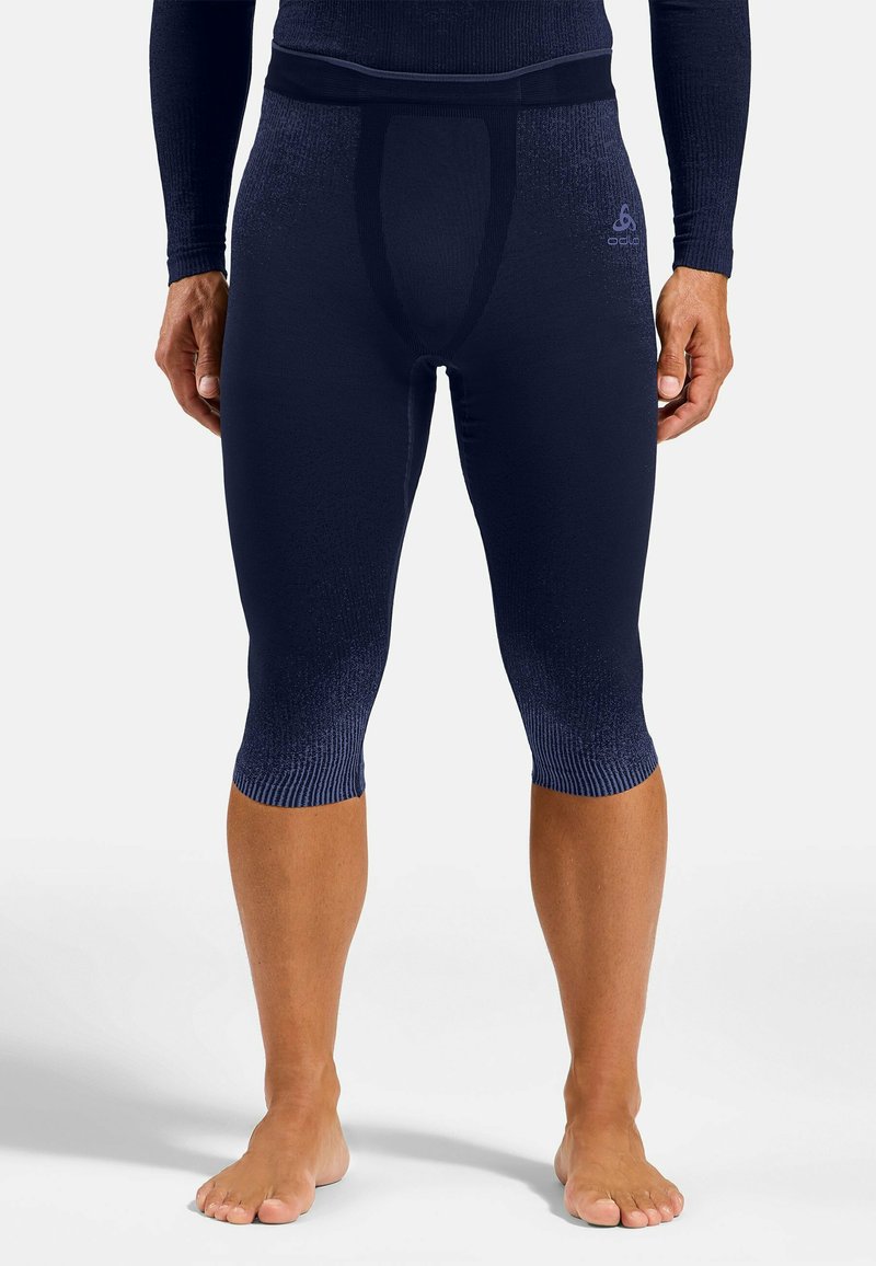 Marineblaue Kompressionsstrumpfhosen mit strukturiertem Finish, unterstützendem Taillenbund und gerippten Bündchen. Entwickelt für optimale Passform und Flexibilität.