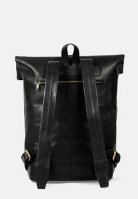 Black leather backpack with a roll-top design, padded shoulder straps, and a front zip pocket, featuring subtle quilted texture.