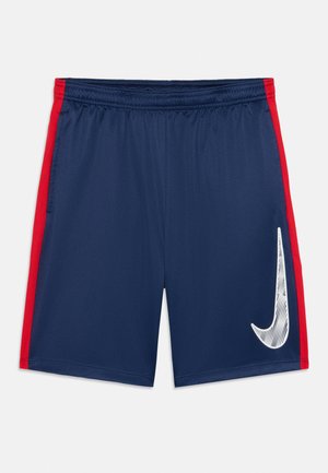 Navy blue athletic shorts with red side stripes and a large white Nike swoosh on the right leg, featuring an elastic waistband.