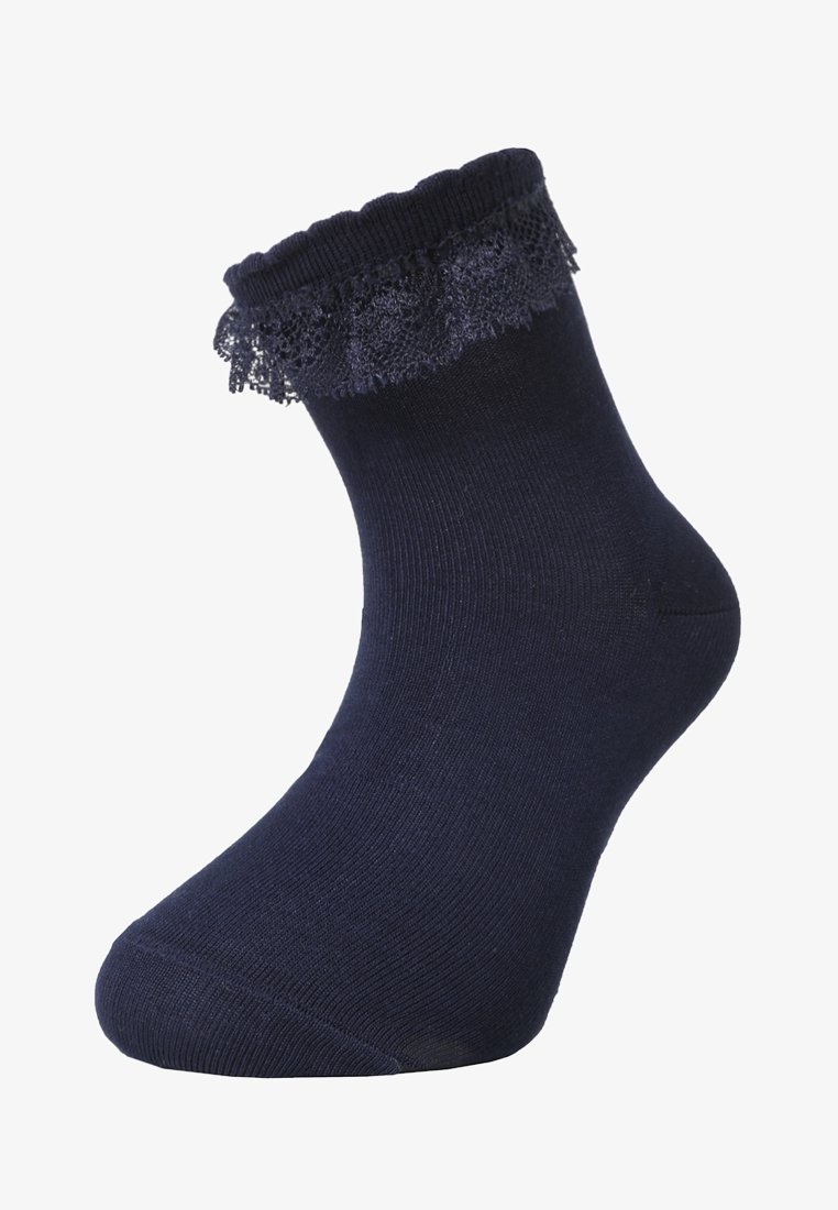 Marineblaue Knöchelsocke mit einem gewellten Spitzenrand oben. Hergestellt aus einem weichen, dehnbaren Material mit einer glatten Textur.