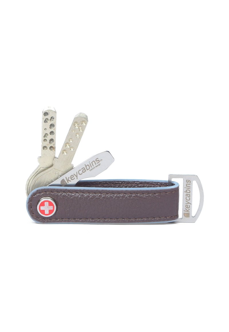 Brown leather key holder with silver metal key blades and a red Swiss cross emblem. Features a sleek, compact design with an integrated clip.