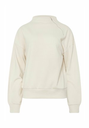 Cream-colored pullover sweatshirt with a high neckline, front zipper detail, drop shoulders, and ribbed cuffs and hem. Soft, textured fabric.