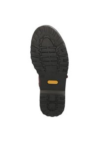 Zwarte rubberen zool met een geribbeld patroon, met een gele accent in het midden. Duurzaam ontwerp met duurzame loopvloeren voor grip.