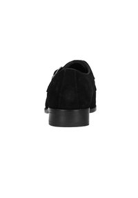 Black suede shoe with a smooth texture, rounded toe, and low black heel. Includes a decorative metal buckle on the side.