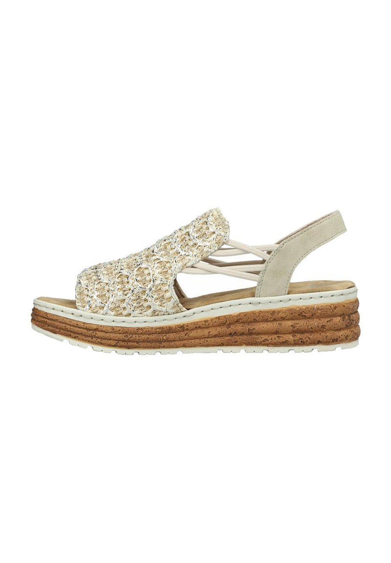 Beige wedge sandal with woven textile upper, open toe design, elastic straps, and textured cork-like sole. White stitching detail visible.