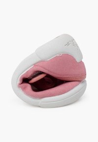 Pink and white fabric shoe with a soft, textured outer and a rounded shape. Interior shows a plush lining and minimal branding detail.
