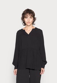 Blusa preta de mangas compridas com decote em V e design plissado, feita em tecido suave. Apresenta um corte descontraído e pregas na cintura.