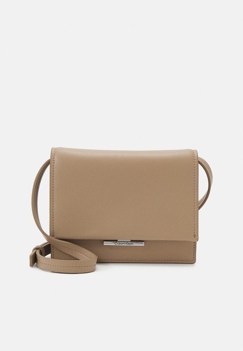 Calvin Klein LINEAR CROSSBODY - Cross body bag - chanterelle