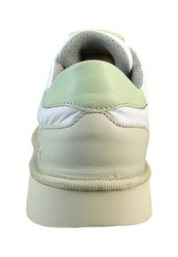 White sneaker with a smooth leather upper, green accents, cushioned collar, and a durable rubber sole, showcasing a rounded, classic design.