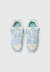 Blue and cream sneakers feature a suede and leather upper with perforated toe, textured accents, and blue insoles displaying the logo.