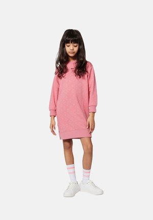 Pink sweatshirt dress with long sleeves, featuring a textured pattern, ribbed cuffs, and a buttoned hem. Paired with striped socks and white sneakers.