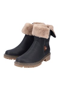 Bottes en cuir noir à la cheville avec un revers en fausse fourrure beige. Dotées d'une fermeture éclair latérale, d'un accent marron et d'une semelle en caoutchouc texturée pour adhérence.