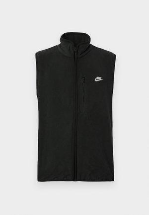 Fekete polármellény magas gallérral és elülső cipzárral. Jellemzője egy kis cipzáras zseb és egy fehér Nike logó a bal felső oldalon.