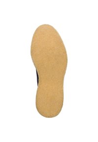 Schuhsohle mit einer strukturierten, beigen Oberfläche, ovaler Form und einem leicht erhöhten Außenrand, entworfen für Grip und Haltbarkeit.