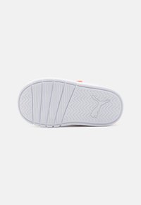 Weißer Sportschuhsohle mit Zickzackprofil und zentralem Logo. Aus solidem Gummi-Material und mit strukturiertem Grip für besseren Halt.