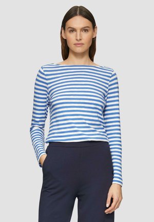 Long-sleeve striped top in light blue and white cotton with a boat neckline and a relaxed fit, paired with dark navy pants.