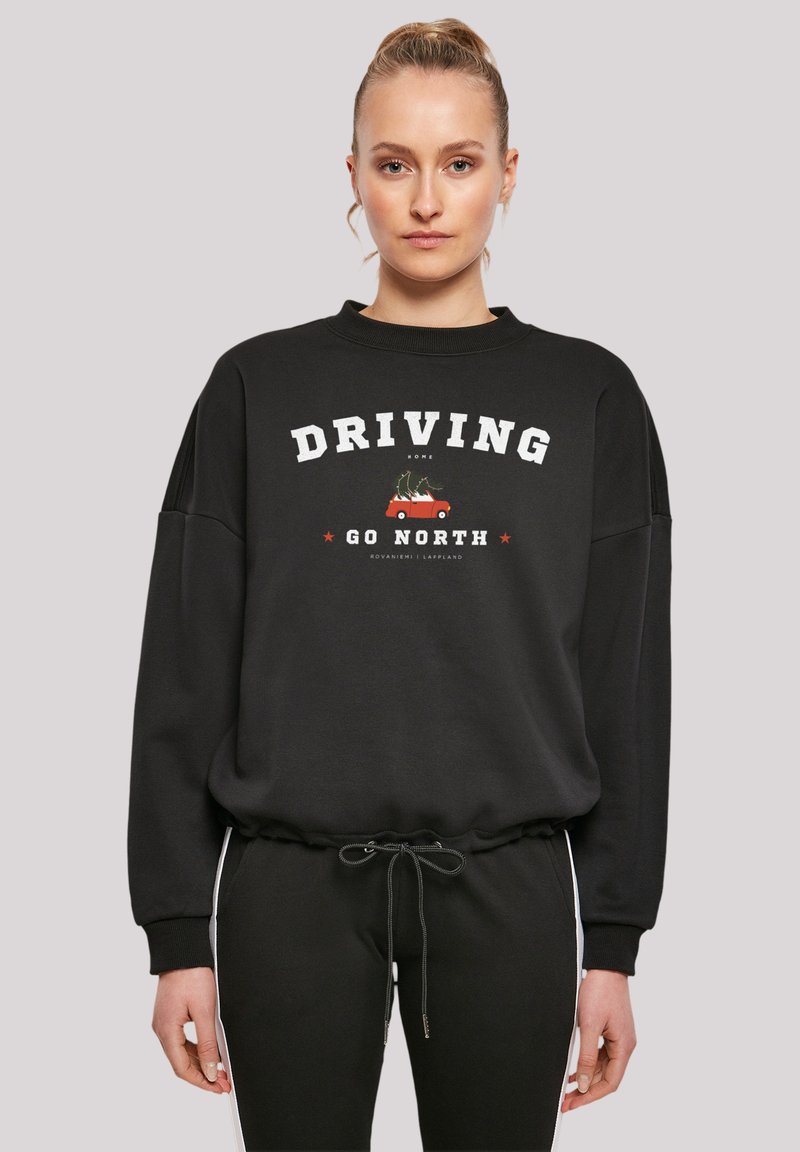 Black sweatshirt featuring "DRIVING GO NORTH" text and graphics, ribbed neckline, and adjustable drawstring hem. Smooth fabric texture.