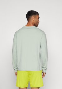 Nike Performance DRI-FIT UV HYVERSE - Topper langermet - jade horizon/black