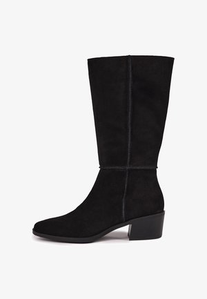 Black mid-calf suede boot with a slightly squared toe, visible vertical seams, and a low block heel.
