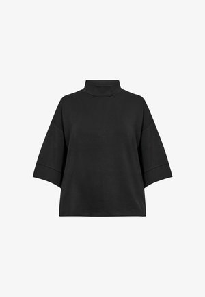 Sort løs turtleneck top med bredde ærmer i albuelængde og sænkede skuldersømme, præsenteret på en hvid baggrund.