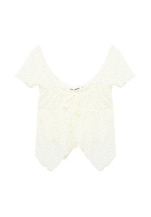 Top corto blanco de encaje con mangas cortas, escote redondo y detalle de lazo delantero, con bordes de dobladillo festoneado.
