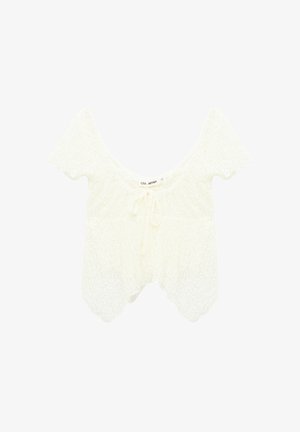 Top corto blanco de encaje con mangas cortas, escote redondo y detalle de lazo delantero, con bordes de dobladillo festoneado.