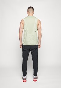 Nike Performance Träningsbyxor - black