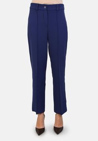 Pantalons ajustés bleu marine avec une texture lisse, taille mi-haute et un système de fermeture à bouton. Comprend des poches latérales et un ourlet large à revers.