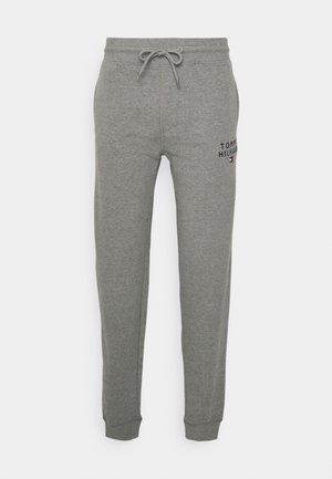 Szürke, pamut keverék anyagból készült melegítőnadrág, rugalmas derékrésszel és húzózsinórral, bordázott mandzsettákkal és hímzett "Tommy Hilfiger" logóval.