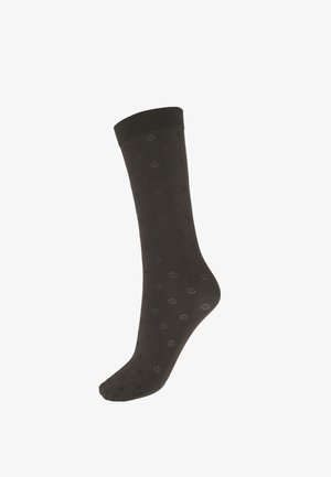 Calzino marrone alla caviglia in tessuto morbido, con motivo floreale su tutta la superficie e polsino a coste in alto. Tessitura liscia.