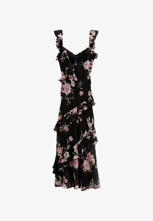 Robe noire à fleurs présentant des fleurs roses, des bretelles volantées et des détails asymétriques volantés le long de l'avant et de l'ourlet pour une texture ajoutée.