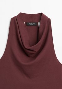 Sleeveless burgundy top with a draped cowl neck and a Massimo Dutti label at the back inside collar.