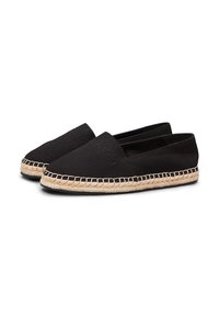 Espadrillas nere in tela con suola in juta intrecciata, design piatto e bordo cucito lungo i lati. Nessun branding visibile.