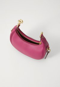 Small pink leather handbag with a rounded shape, gold zipper and hardware, featuring decorative keychain and stitching details.