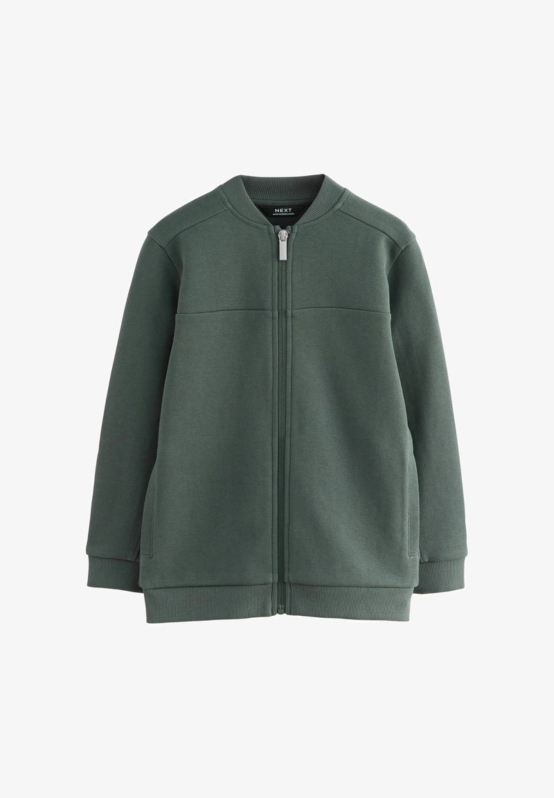 Dunkelgrüne Zip-Jacke mit geripptem Kragen, Bündchen und Saum, die zwei Seitentaschen und eine strukturierte Stoffoberfläche aufweist.