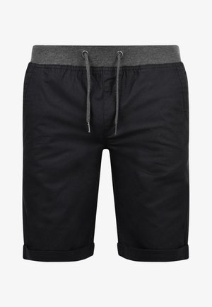 Fekete rövidnadrág, húzózsinórral az derékrészen, szürke színben, feltekerhető szegéllyel. Könnyű anyagból készült, a kényelem és a hétköznapi viselet érdekében.