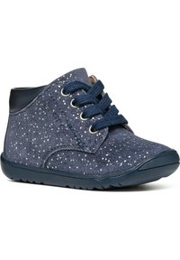 Navy suede ankle boots with white speckles, featuring dark blue laces, a rounded toe, and a flexible rubber sole. Simple flap design.