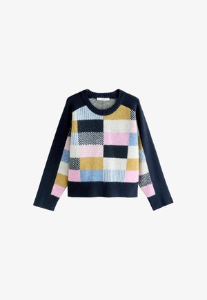 Kootud kampsun, millel on mitmevärviline plaastrimuster tumesinise, kollase, roosa, sinise ja mustade detailidega. Ümar kaelus ja pikad varrukad.