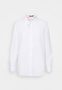 Weißes langärmliges Hemd aus Baumwolle mit Knopfleiste. Verfügt über einen spitzen Kragen und einen geraden Schnitt. Enthält ein rotes Etikett im Kragen.